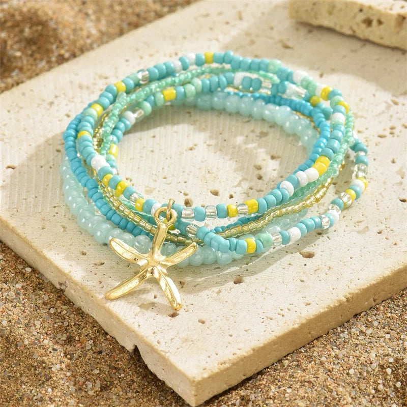 Tobillera Multicapa Estrella de Mar Verano Boho - Emeraldia Jewelry · Operado por R. E. dos Santos LTDA · CNPJ: 45.450.979/0001-38