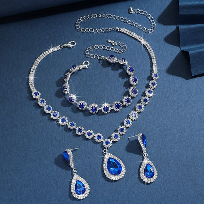 Conjunto de Joyería Nupcial Halo Azul Zafiro en Lágrima - Emeraldia Jewelry · Operado por R. E. dos Santos LTDA · CNPJ: 45.450.979/0001-38