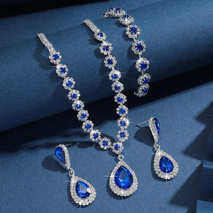 Conjunto de Joyería Nupcial Halo Azul Zafiro en Lágrima - Emeraldia Jewelry · Operado por R. E. dos Santos LTDA · CNPJ: 45.450.979/0001-38