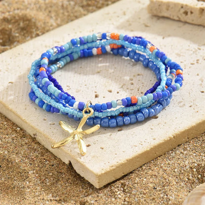 Tobillera Multicapa Estrella de Mar Verano Boho - Emeraldia Jewelry · Operado por R. E. dos Santos LTDA · CNPJ: 45.450.979/0001-38