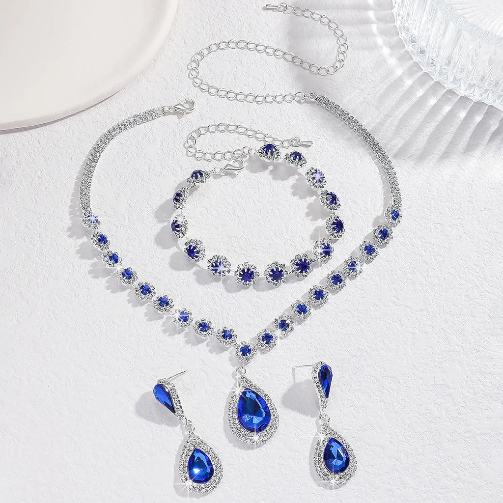 Sapphire Blue Teardrop Halo Bridal Jewelry Set