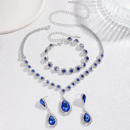 Conjunto de Joyería Nupcial Halo Azul Zafiro en Lágrima - Emeraldia Jewelry · Operado por R. E. dos Santos LTDA · CNPJ: 45.450.979/0001-38