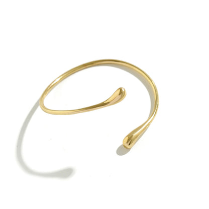 Brazalete de Brazo Dorado Minimalista - Emeraldia Jewelry · Operado por R. E. dos Santos LTDA · CNPJ: 45.450.979/0001-38