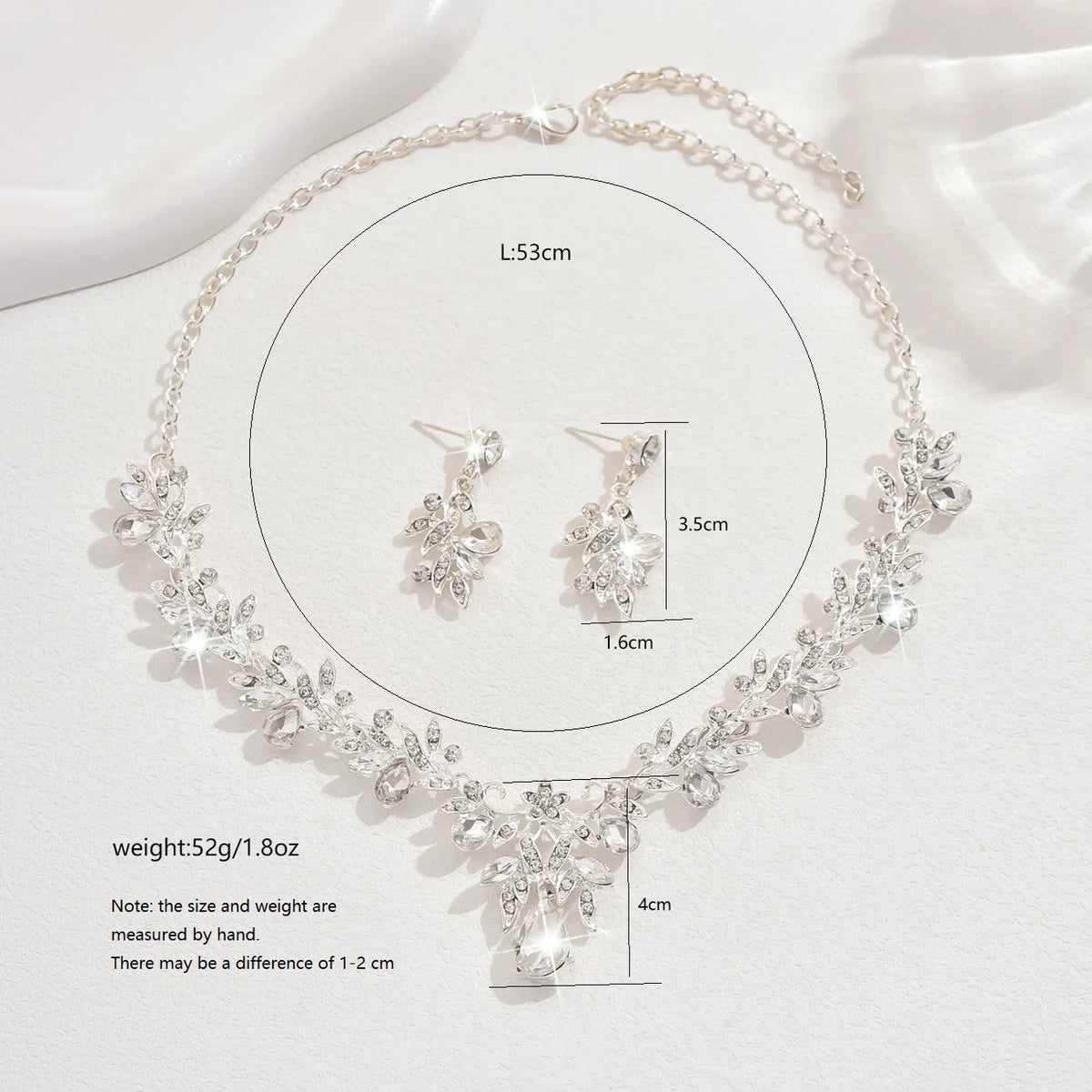 Conjunto de Joyería Nupcial Floral de Cristal Lágrima - Emeraldia Jewelry · Operado por R. E. dos Santos LTDA · CNPJ: 45.450.979/0001-38