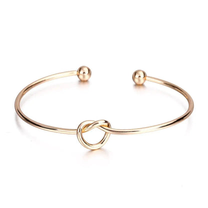 Brazalete Abierto Minimalista Nudo de Amor - Emeraldia Jewelry · Operado por R. E. dos Santos LTDA · CNPJ: 45.450.979/0001-38