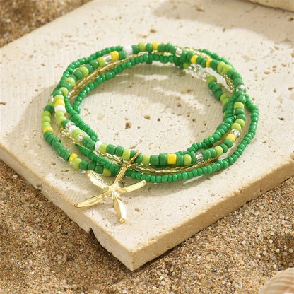 Tobillera Multicapa Estrella de Mar Verano Boho - Emeraldia Jewelry · Operado por R. E. dos Santos LTDA · CNPJ: 45.450.979/0001-38