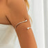 Brazalete de Brazo Dorado Minimalista - Emeraldia Jewelry · Operado por R. E. dos Santos LTDA · CNPJ: 45.450.979/0001-38